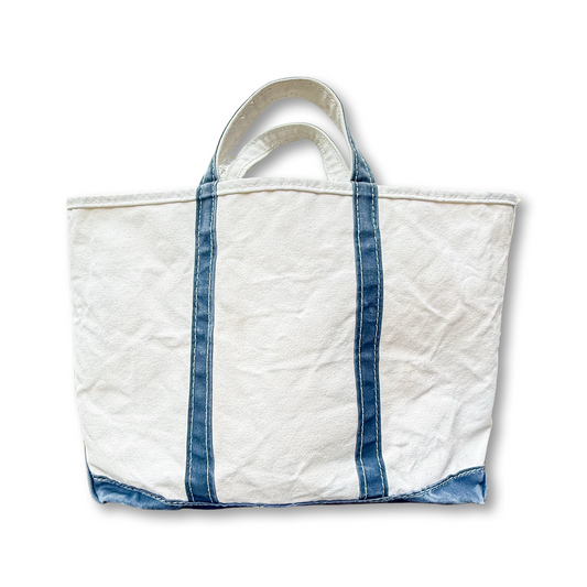 White tote bag with blue accents on a white background
