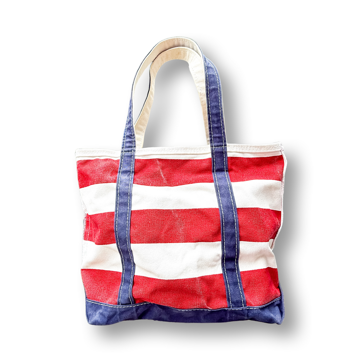 Red and white stripe tote with navy handles on white background 