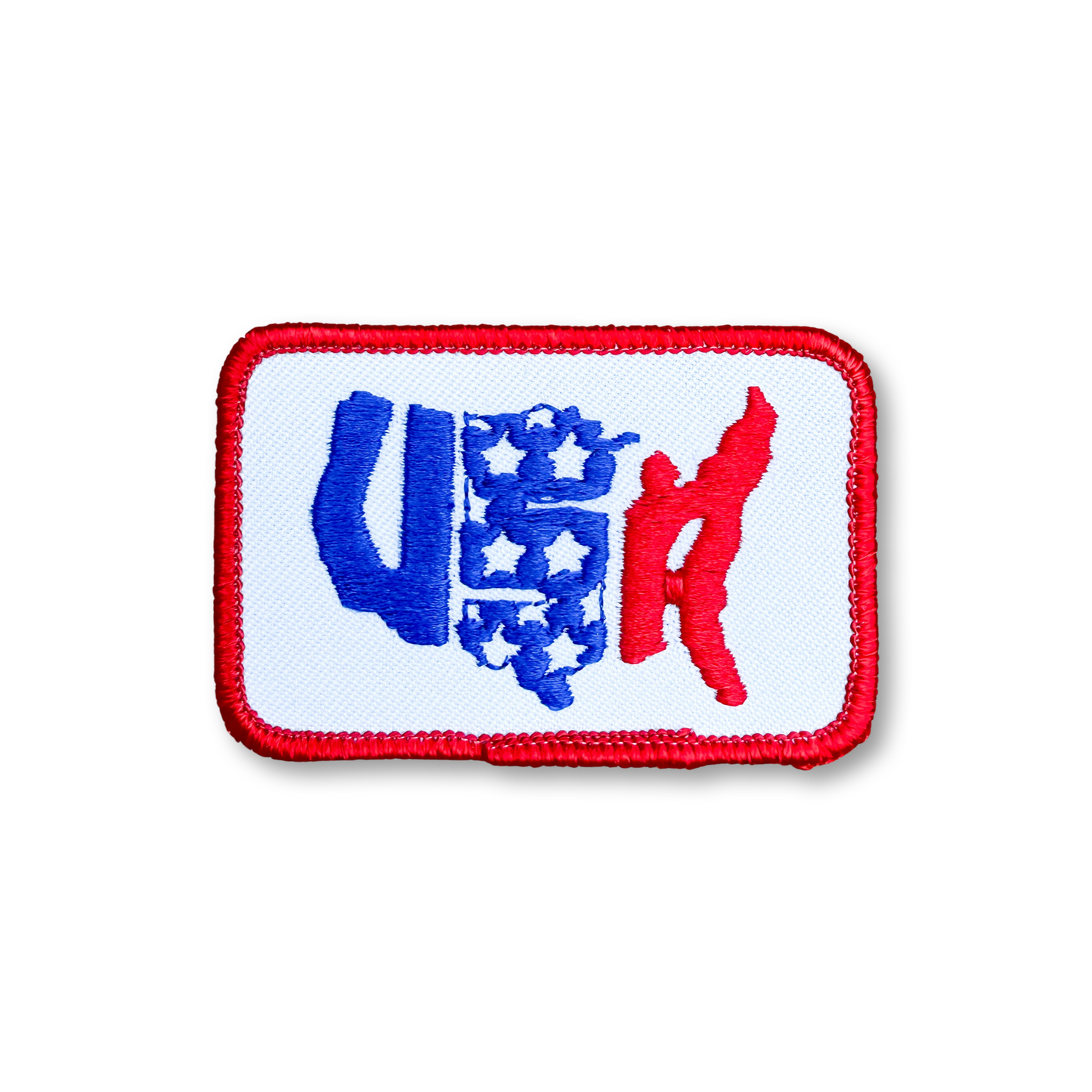 A rectangular embroidered patch with a red border, featuring the letters 'USA' in blue and red over a white background.