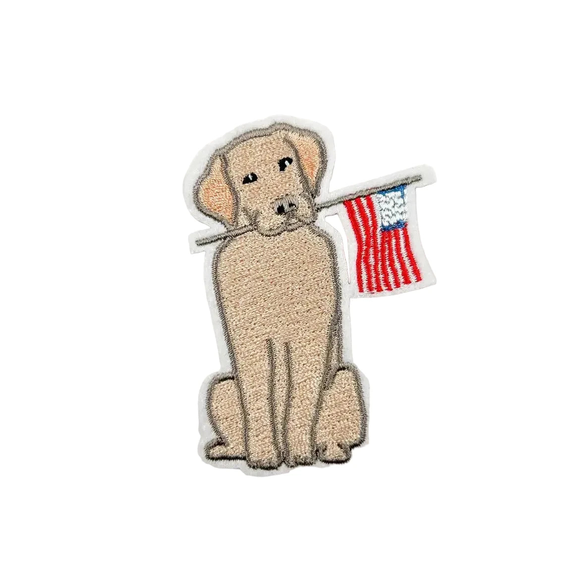 Embroidered patch of a dog holding an American flag on a white background