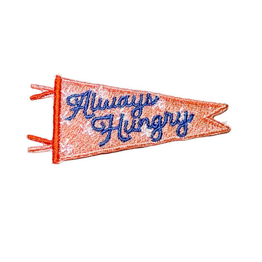 Embroidered patch with 'Always Hungry' text on a white background