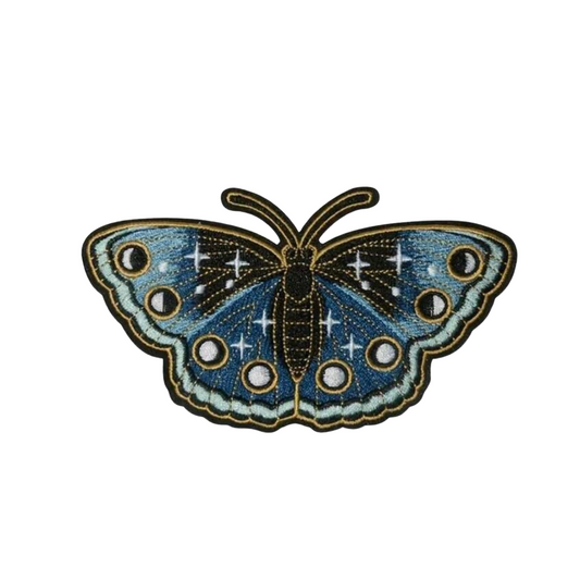 Blue butterfly patch with star-like patterns on a white background