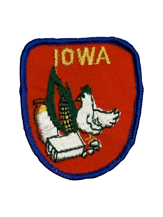 Patch with 'Iowa' text and a design of a dove and corn stalk on a red background