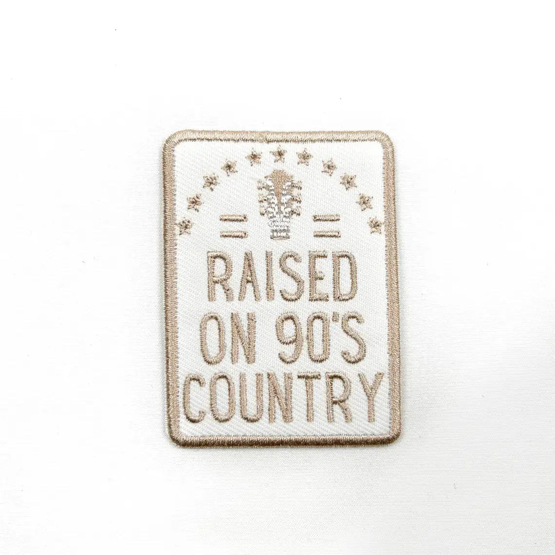 Patch with 'Raised on 90's Country' text on a white background