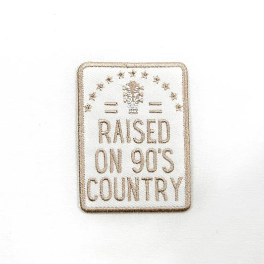 Patch with 'Raised on 90's Country' text on a white background