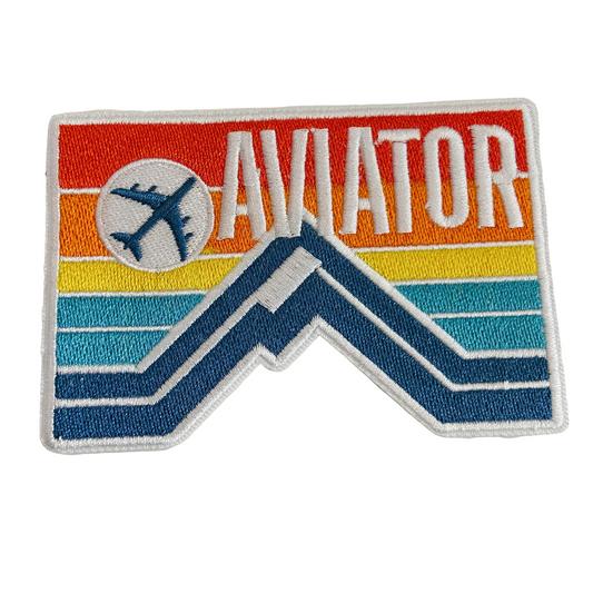 Embroidered patch with 'Aviator' text and airplane icon on a colorful background