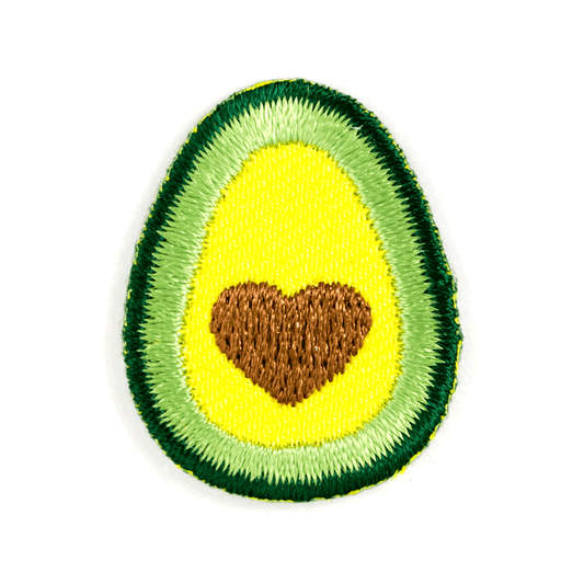 Avocado-shaped patch with a heart in the center on a white background