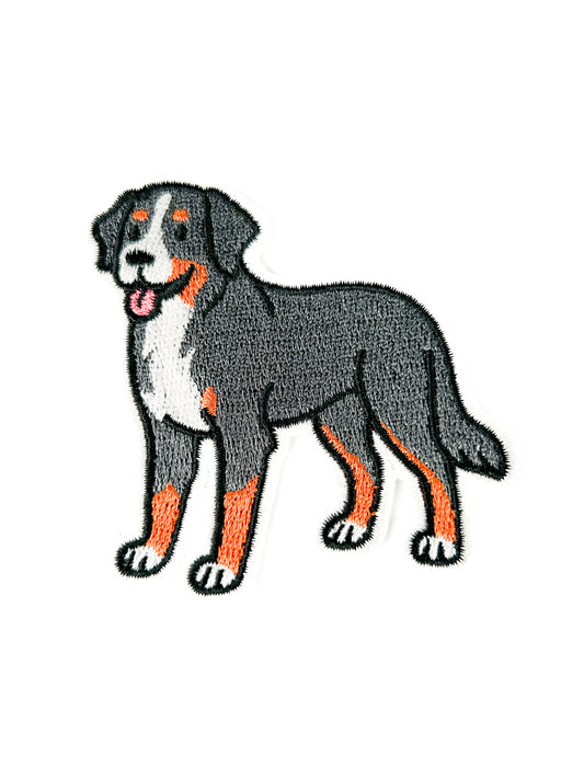 Embroidered patch of a dog on a white background