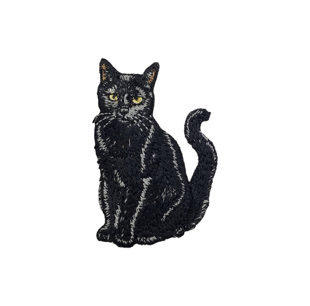 An embroidered patch of a sitting black cat with yellow eyes, shown on a plain white background.