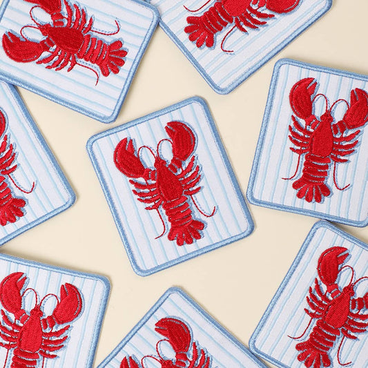 Red lobster patches on blue striped backgrounds arranged in a pattern.