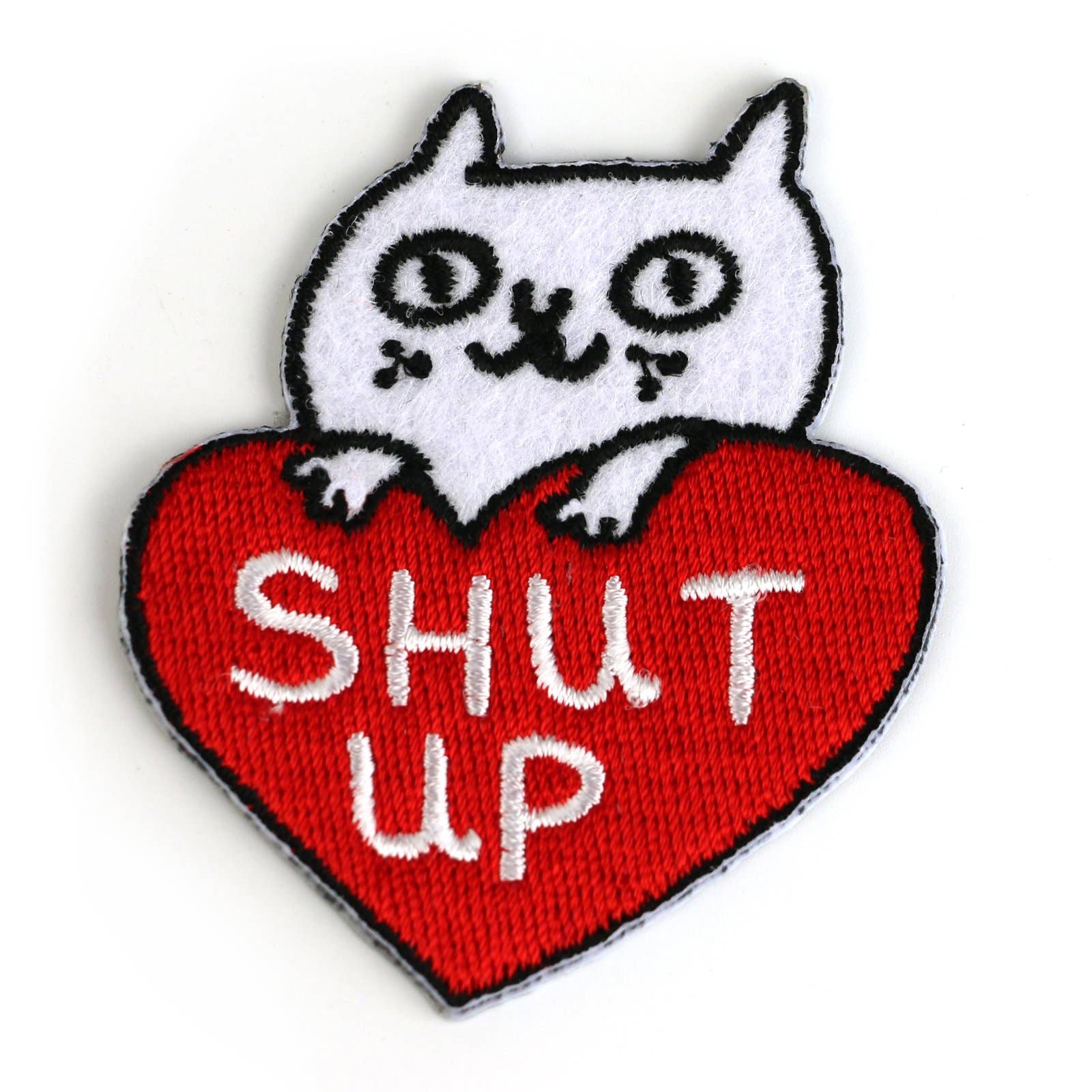 Embroidered patch with a white cat on a red heart-shaped patch with 'SHUT UP' text.