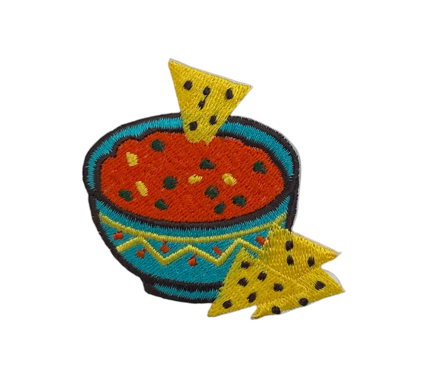 Colorful embroidered patch of a bowl of soup with tortilla chips on a white background