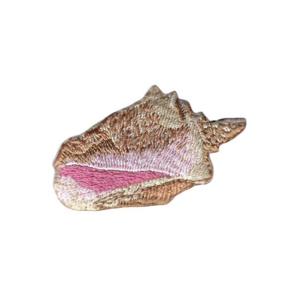 Decorative shell with pink interior on a white background