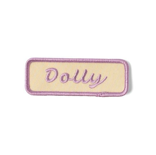 Patch with 'Dolly' text on a beige background