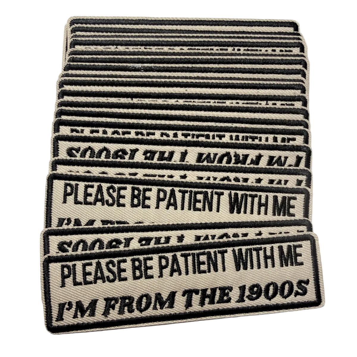 Stack of patches with humorous text on a white background