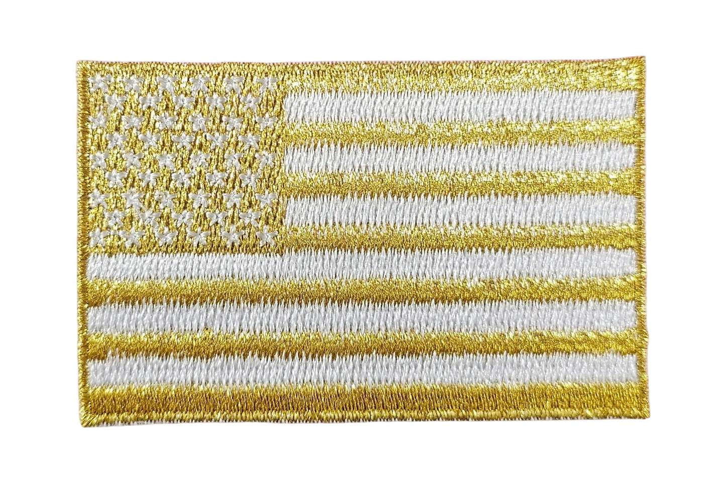 Gold and white American flag patch on a textured white background