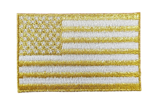 Gold and white American flag patch on a textured white background