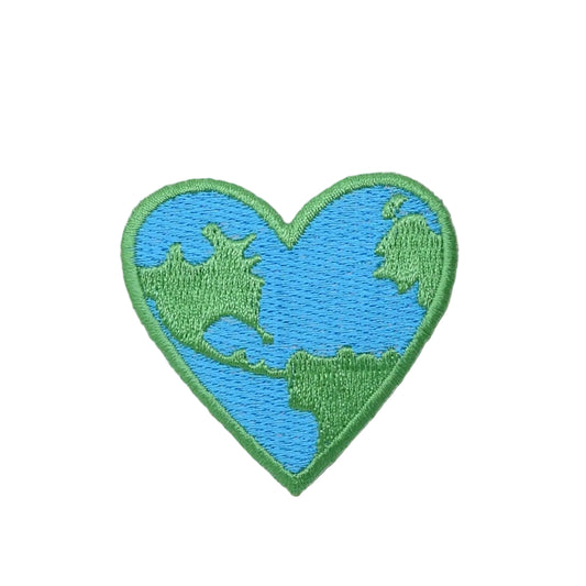 Heart-shaped patch with Earth design on a textured fabric background