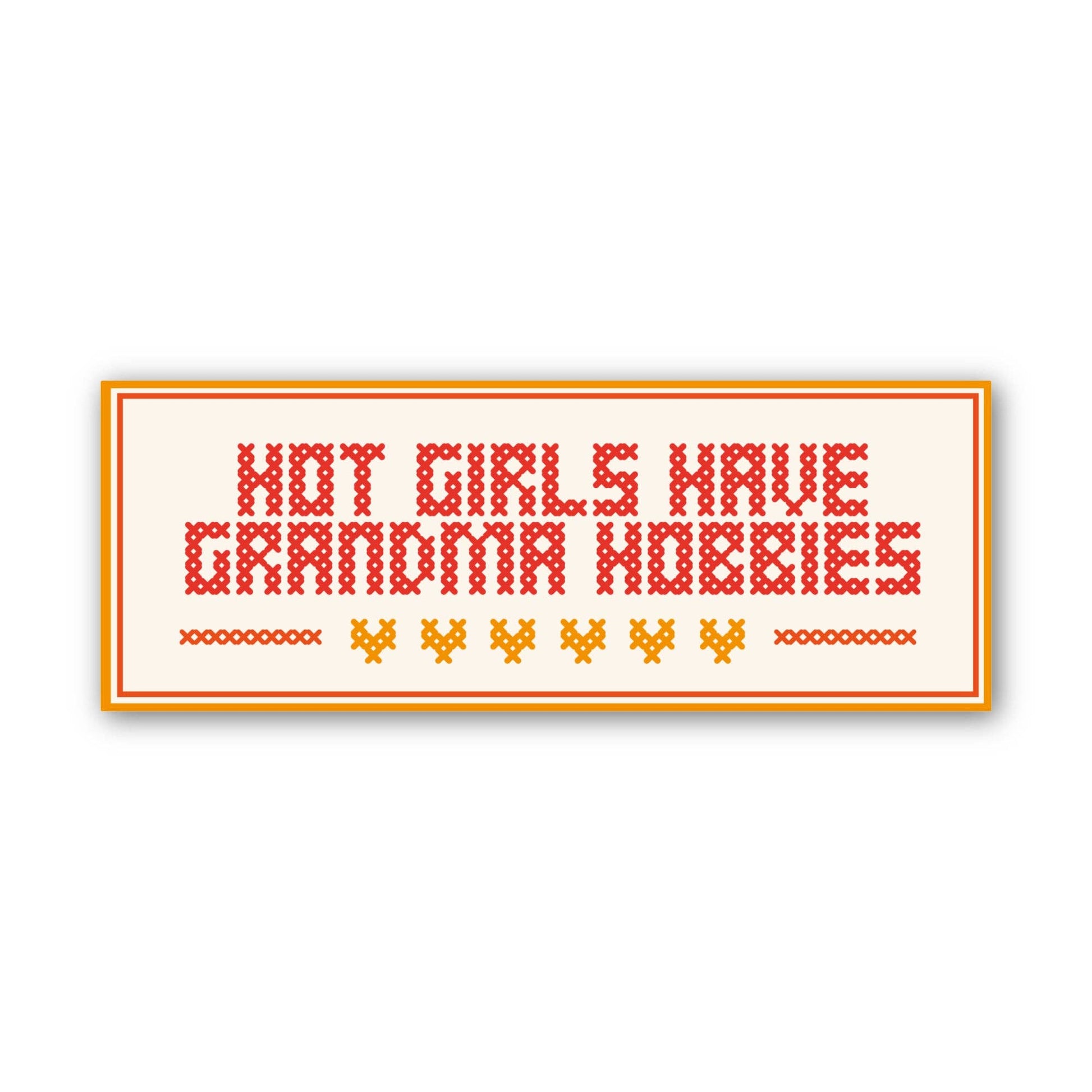 Cross-stitched phrase 'Hot girls have grandma hobbies' on a white background