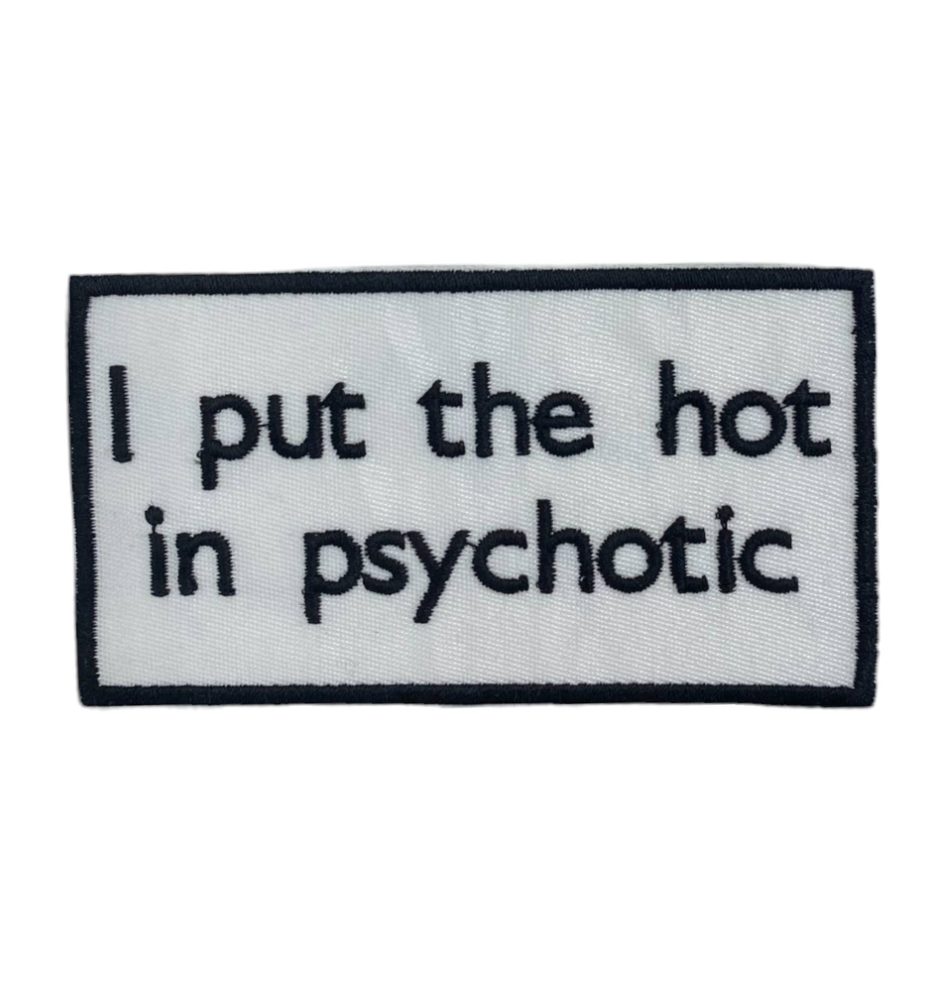 Embroidered patch with text 'I put the hot in psychotic' on a white background