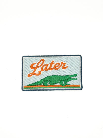 Embroidered patch with an alligator and 'Later' text on a white background