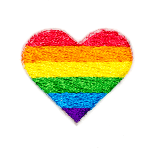 Heart-shaped patch with rainbow stripes on a white background