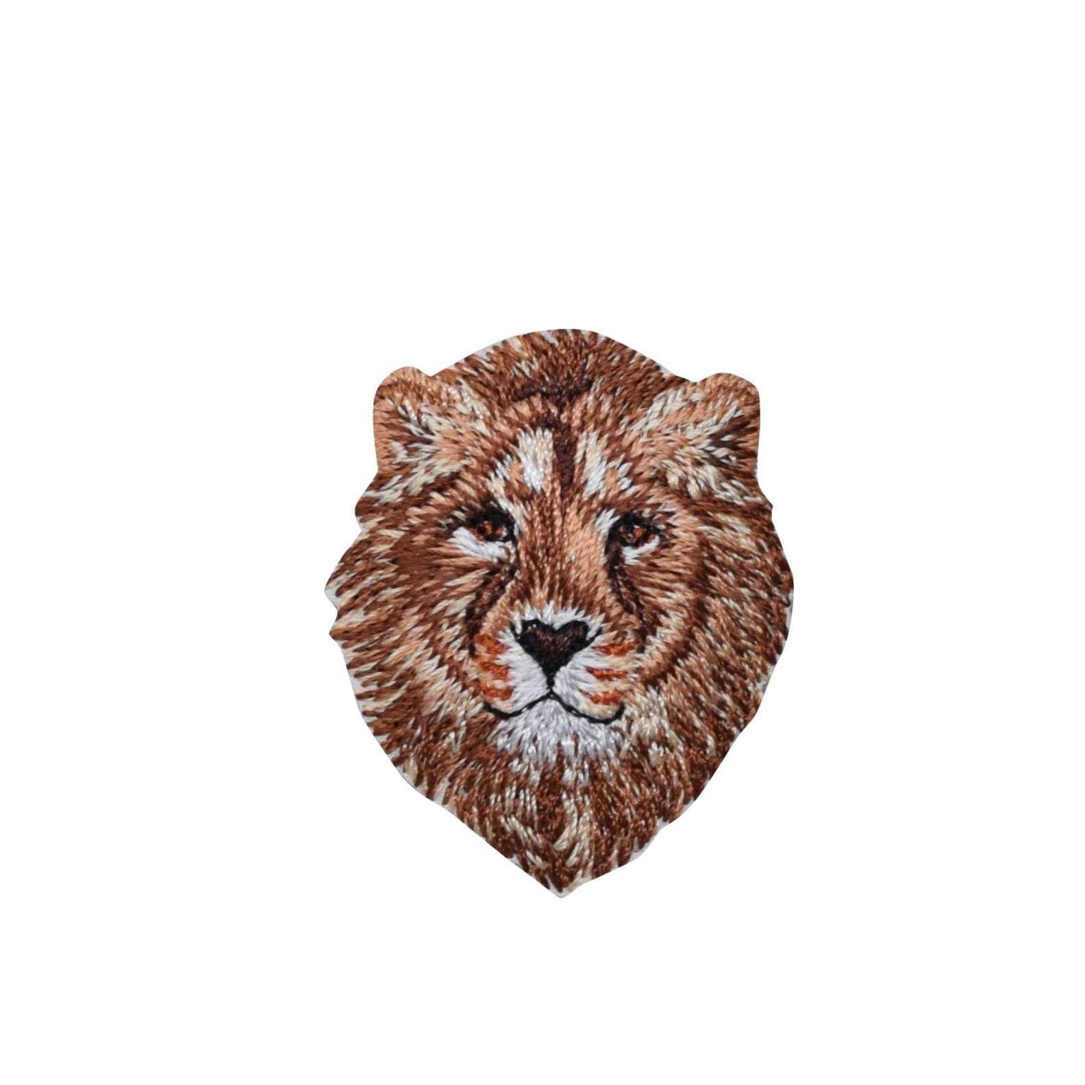 Embroidered patch of a lion's head on a white background