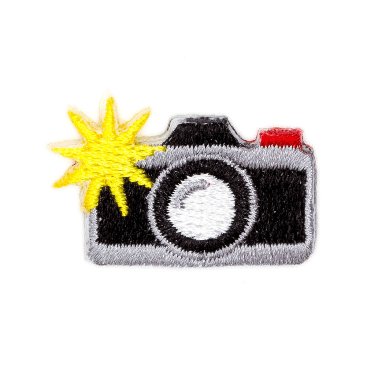 Camera-shaped patch with a sun on a white background