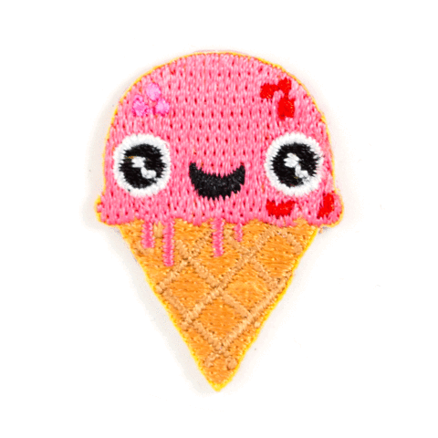 Embroidered patch of a pink ice cream cone with a face on a white background