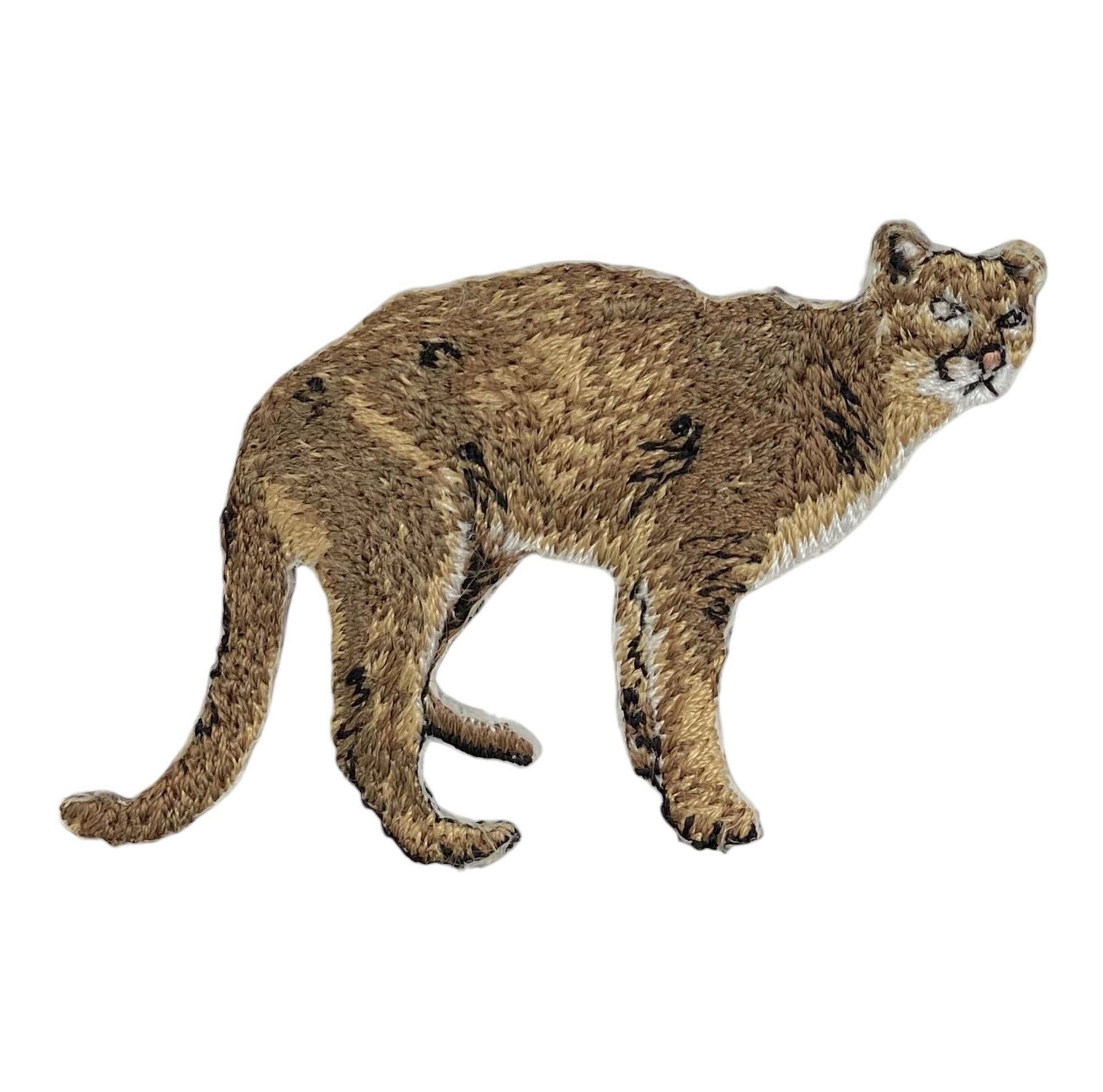 A realistic cougar or mountain lion figurine shown in side profile against a plain white background.