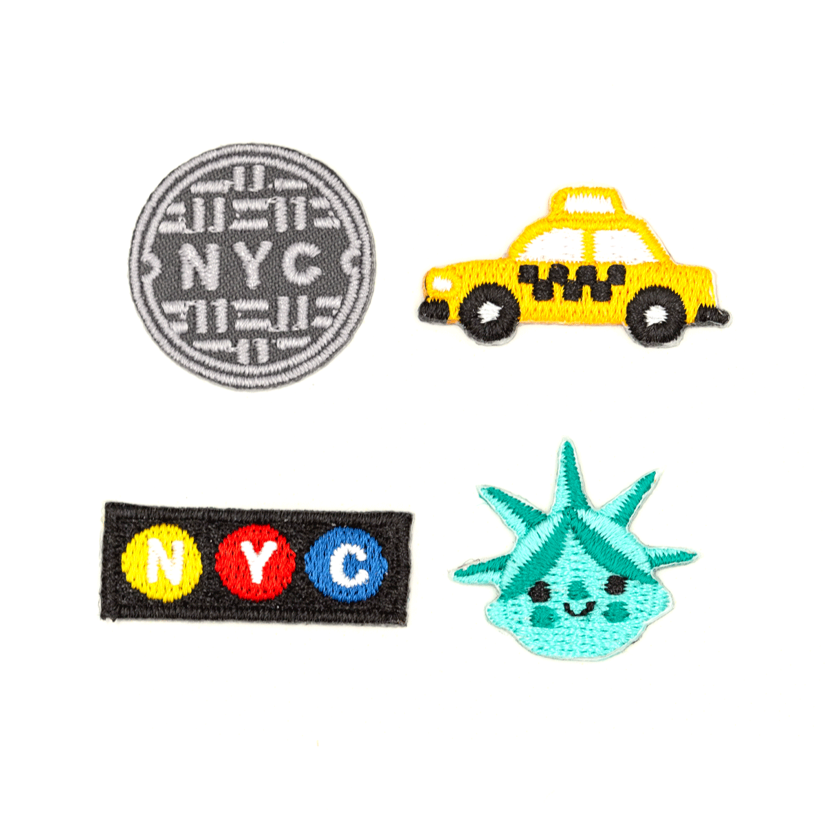 Four embroidered patches featuring NYC symbols on a white background