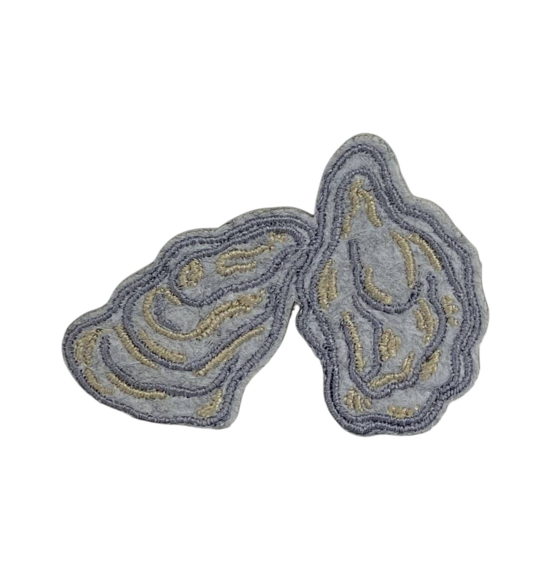 Gray and gold decorative patch on a white background