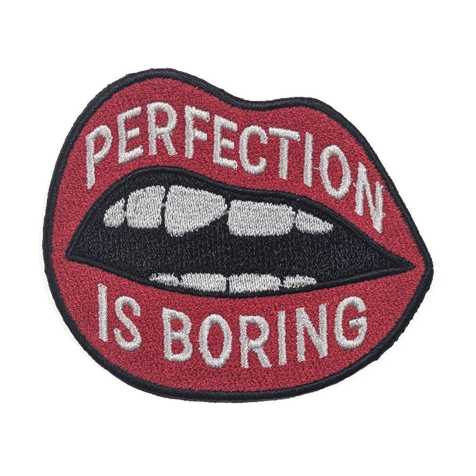 Patch with lips design and text 'Perfection is Boring' on a white background