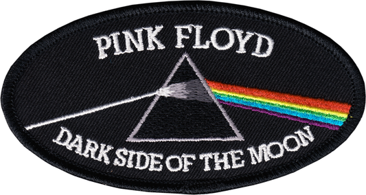 An oval embroidered patch featuring the Pink Floyd 'Dark Side of the Moon' design, with white text, a black triangle, and a rainbow prism on a black background.
