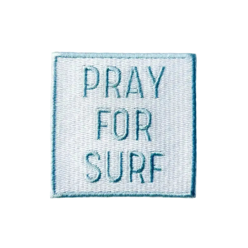 Embroidered patch with 'PRAY FOR SURF' text on a white background
