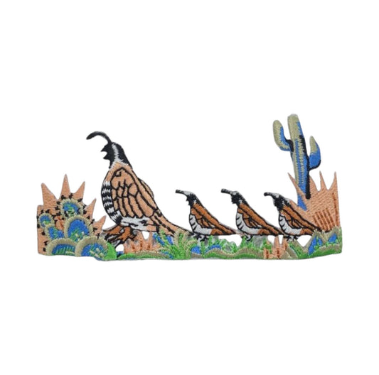 Decorative wall art with quails and cacti on a white background