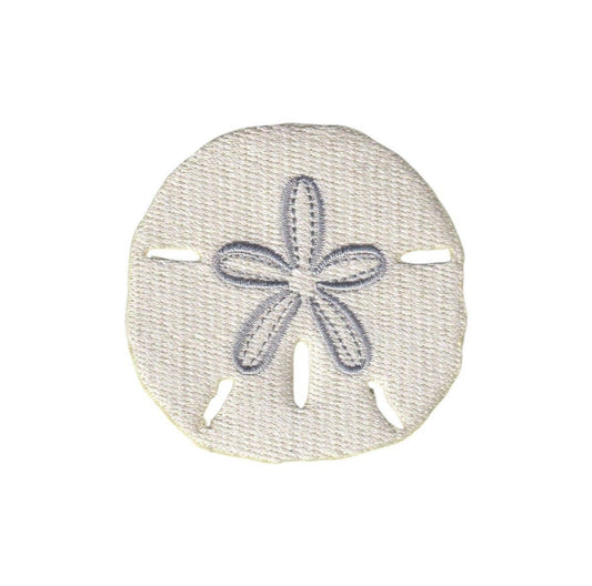 Decorative sand dollar with a starfish design on a white background