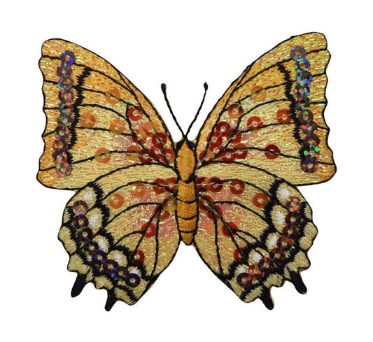 An embroidered butterfly patch with golden-yellow wings, black outlines, and red, orange, and purple spotted details, shown on a plain white background.