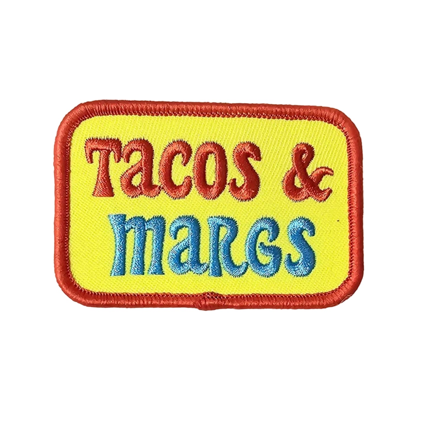 Embroidered patch with 'Tacos & margs' text on a yellow background