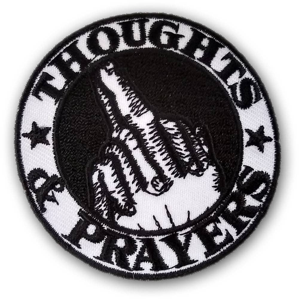 Circular patch with black and white design on a white background