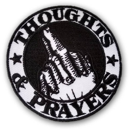 Circular patch with black and white design on a white background