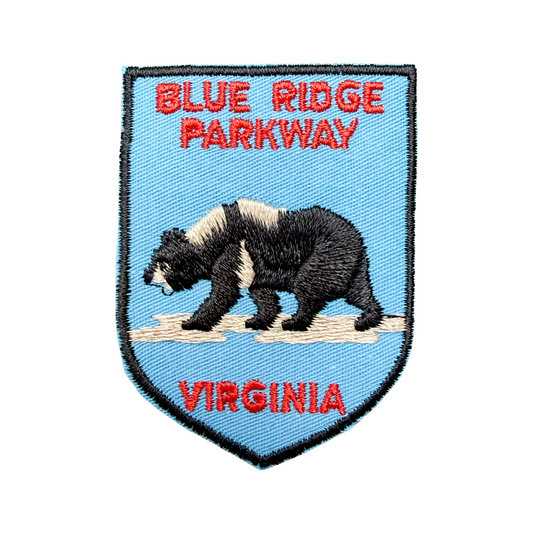 Embroidered patch with a bear, 'Blue Ridge Parkway', and 'Virginia' text on a blue background.