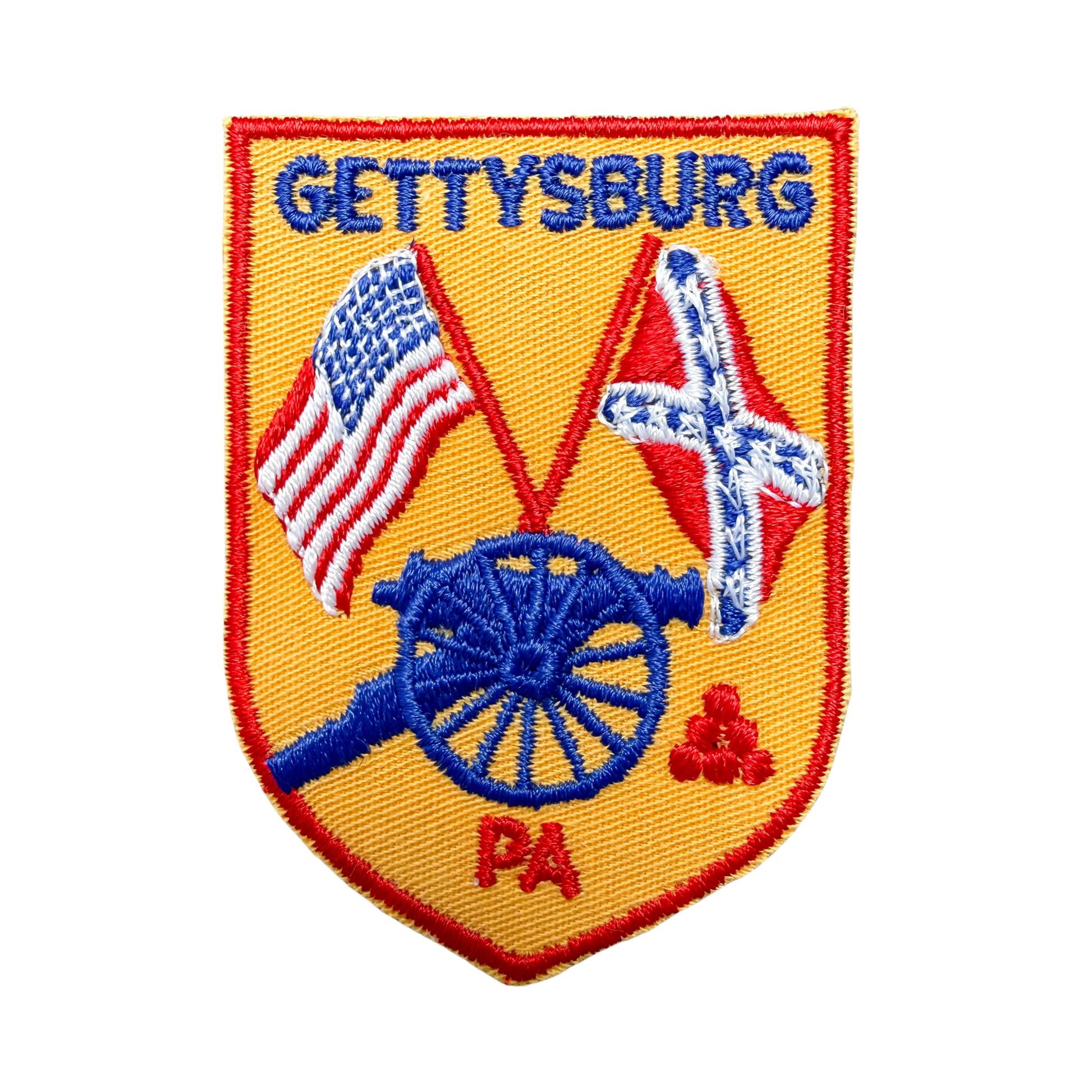 Patch with 'Gettysburg PA' text, American flag, and cannon on a yellow background