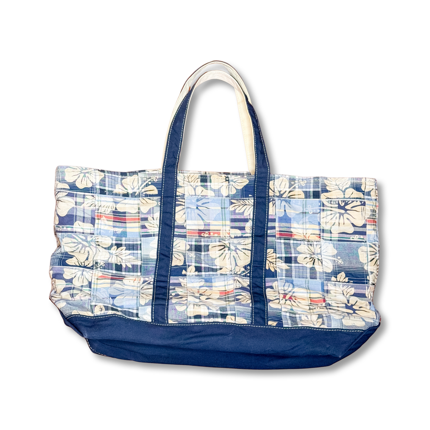 Floral patterned tote bag with blue accents on a white background