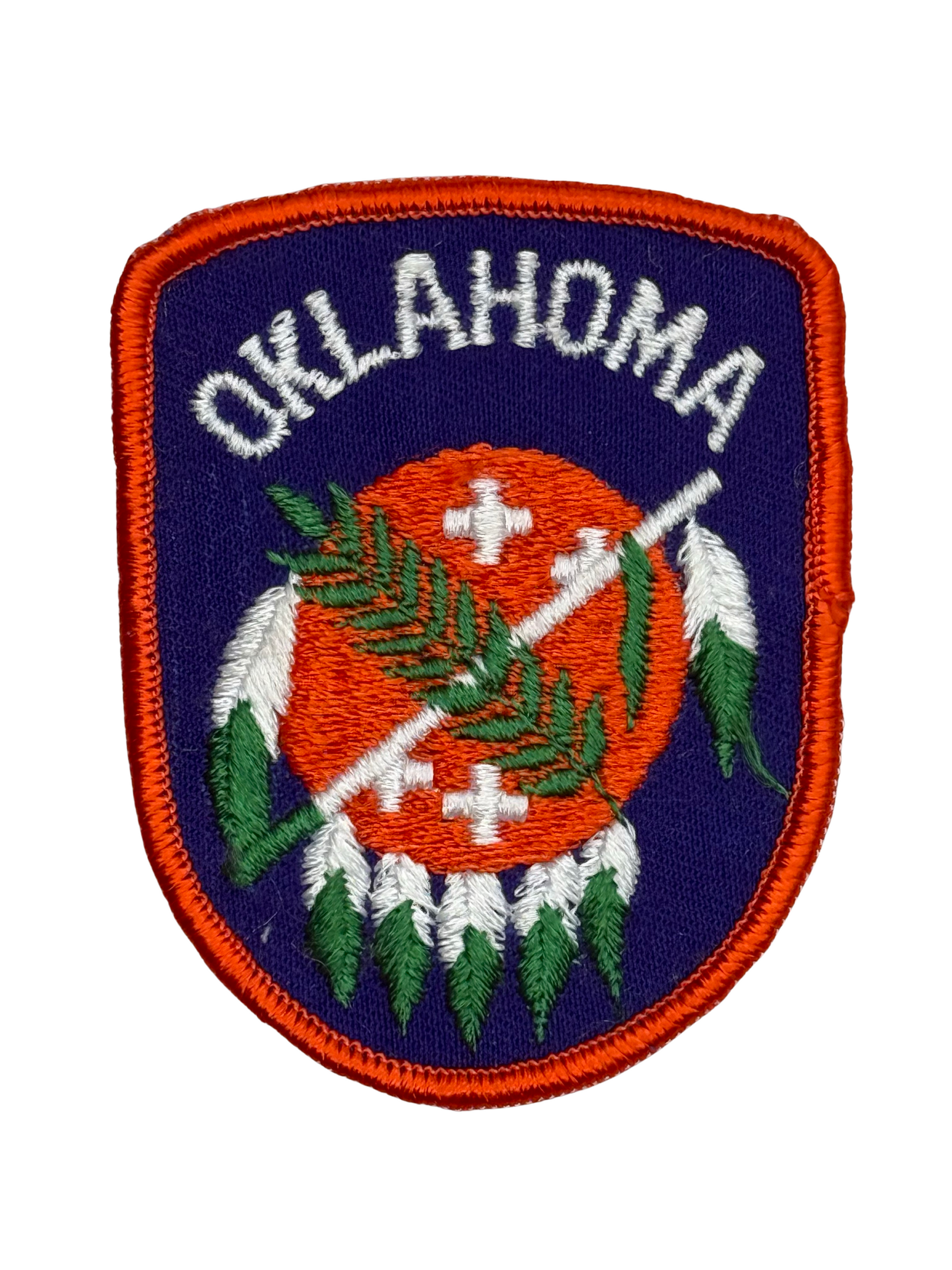 Embroidered patch with 'Oklahoma' text and native design on a white background