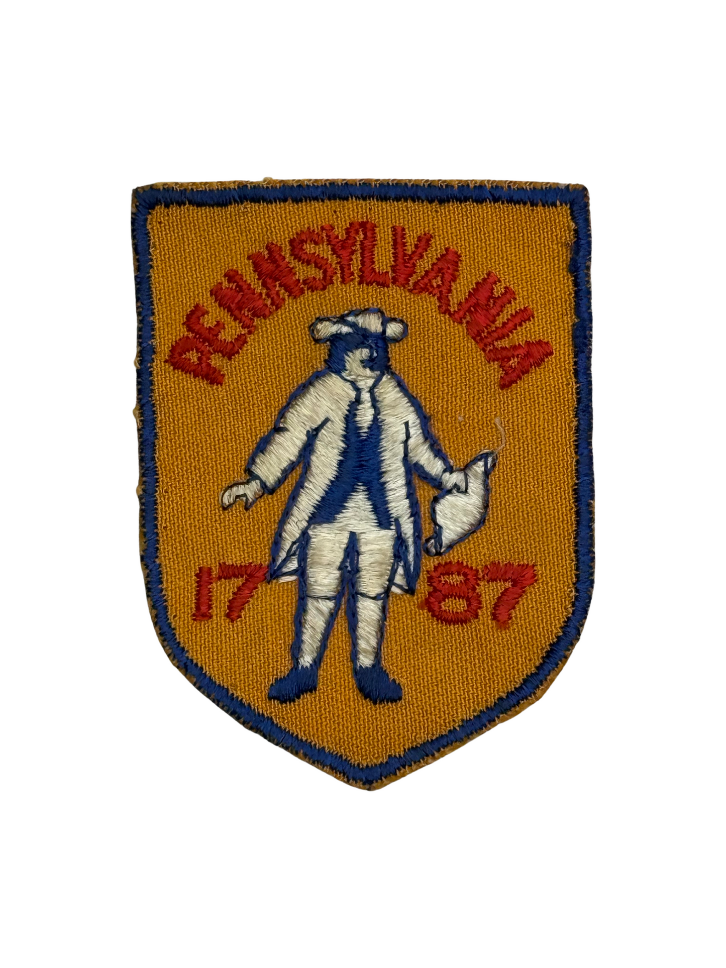Embroidered patch with 'Pennsylvania 1787' text and a historical figure on an orange background.