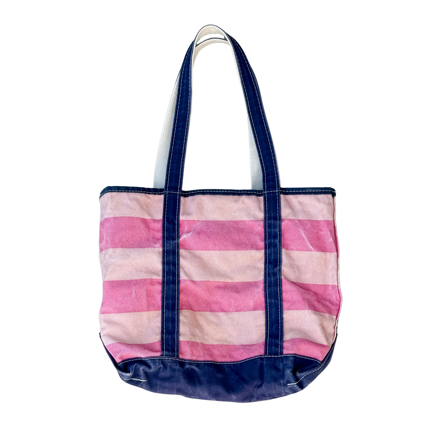 Striped tote bag with pink and white stripes on a white background