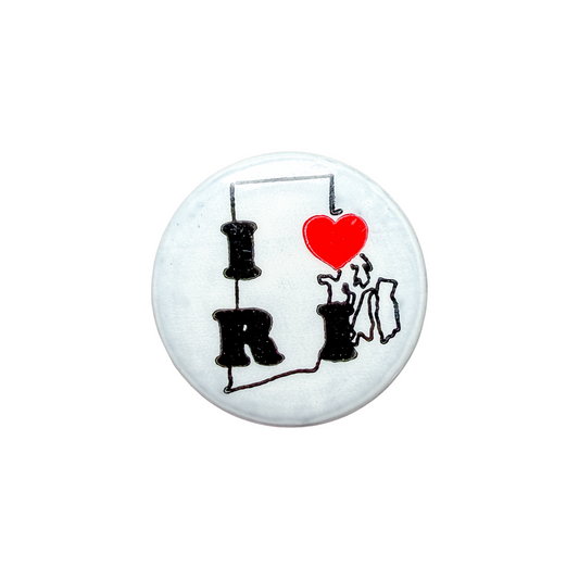 Round white button with 'I ❤️ RP' design on a white background