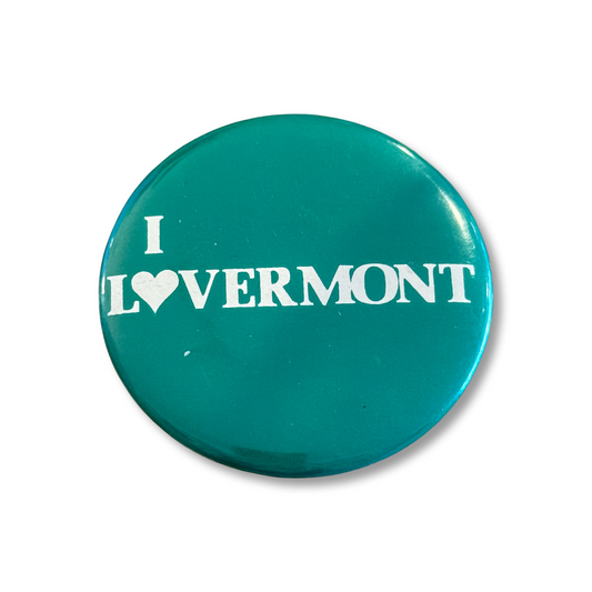 Teal button with 'I ❤️ Vermont' text on a white background