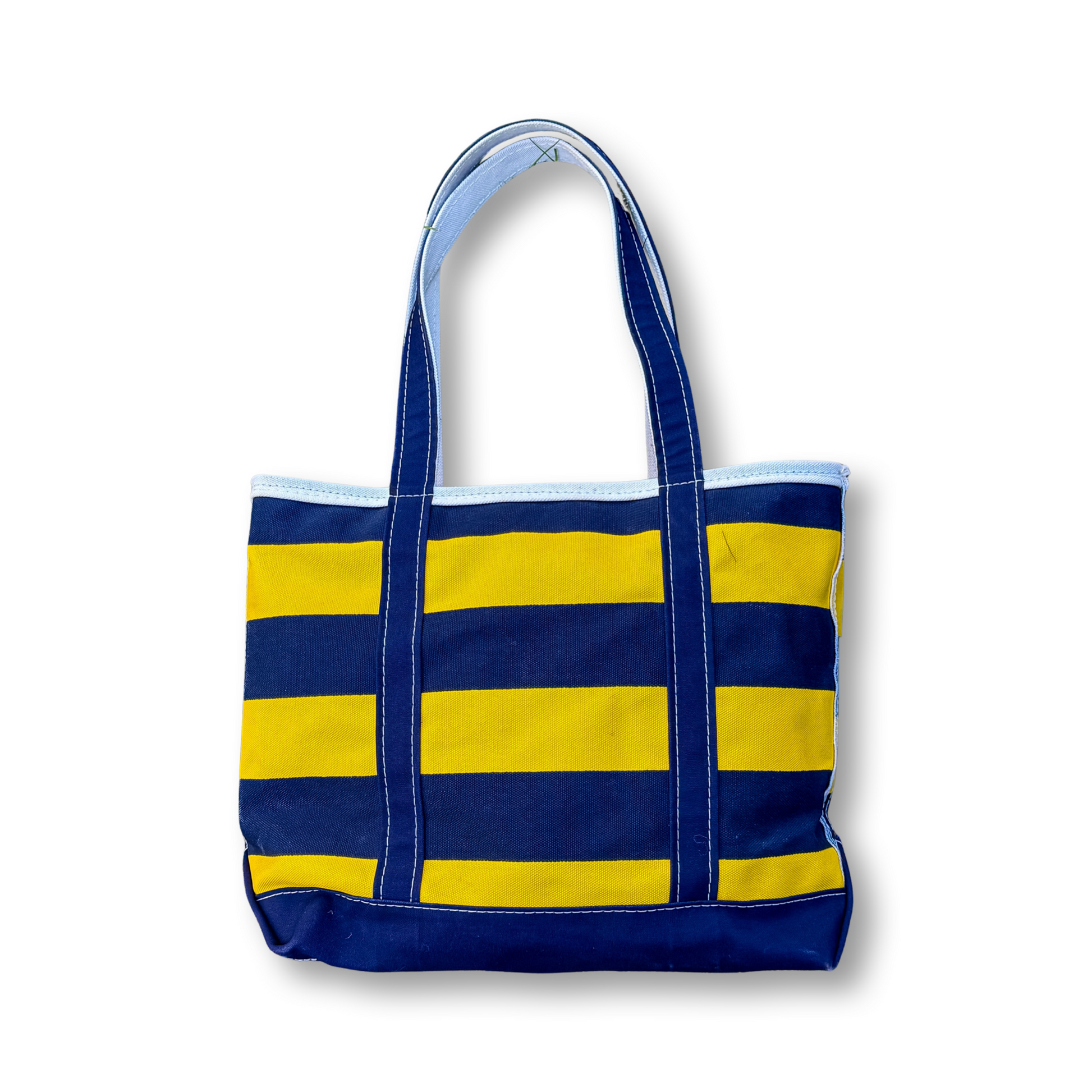 Blue and yellow striped tote bag on a white background